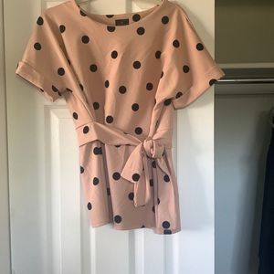 Pink polka dot wrap-style top